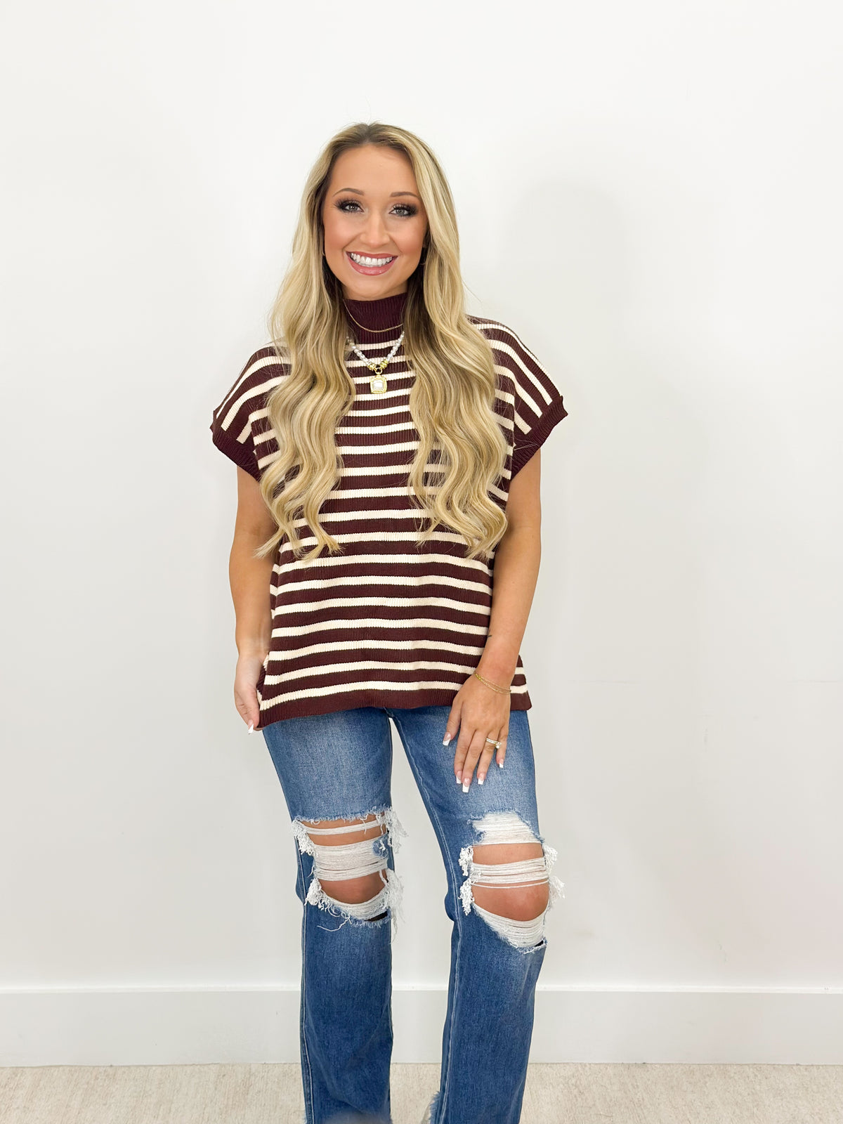 Burgundy and white striped mock neck sweater with short sleeves and ribbed collar