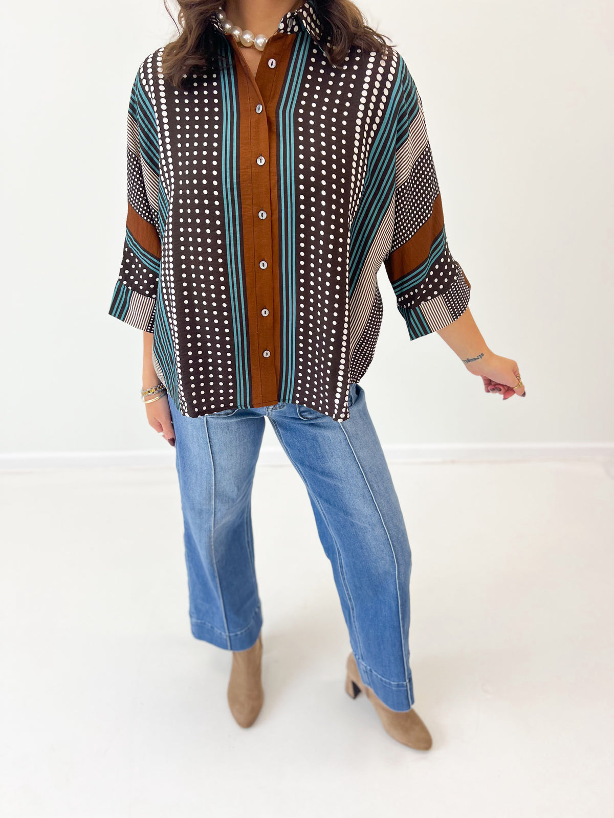 Brown mixed-print stripe shirt with button front, short sleeves, teal and white stripe/dot panels