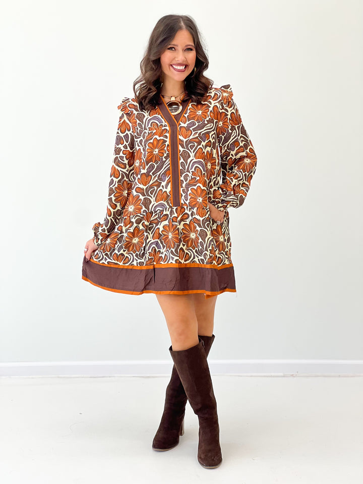 Brown floral V-neck ruffle dress with long puff sleeves and straight button placket