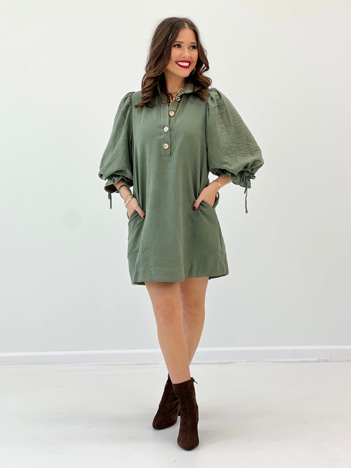 Olive button-front mini dress with ruched shoulders and gathered puff sleeves