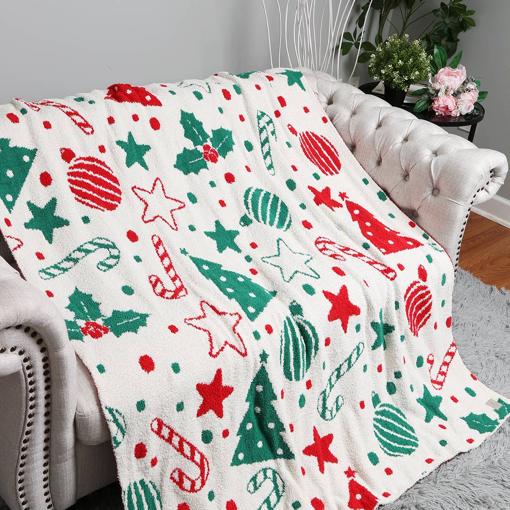 Cream throw blanket with red and green Christmas print