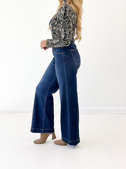 Dark mid-rise wide-leg denim jeans with back yoke and patch pockets