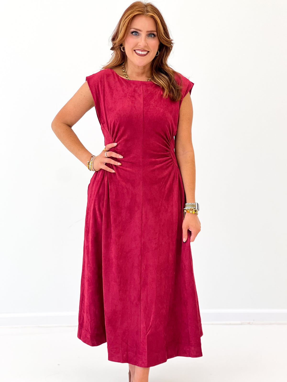 Burgundy faux suede midi dress with sleeveless design and side seam detailing