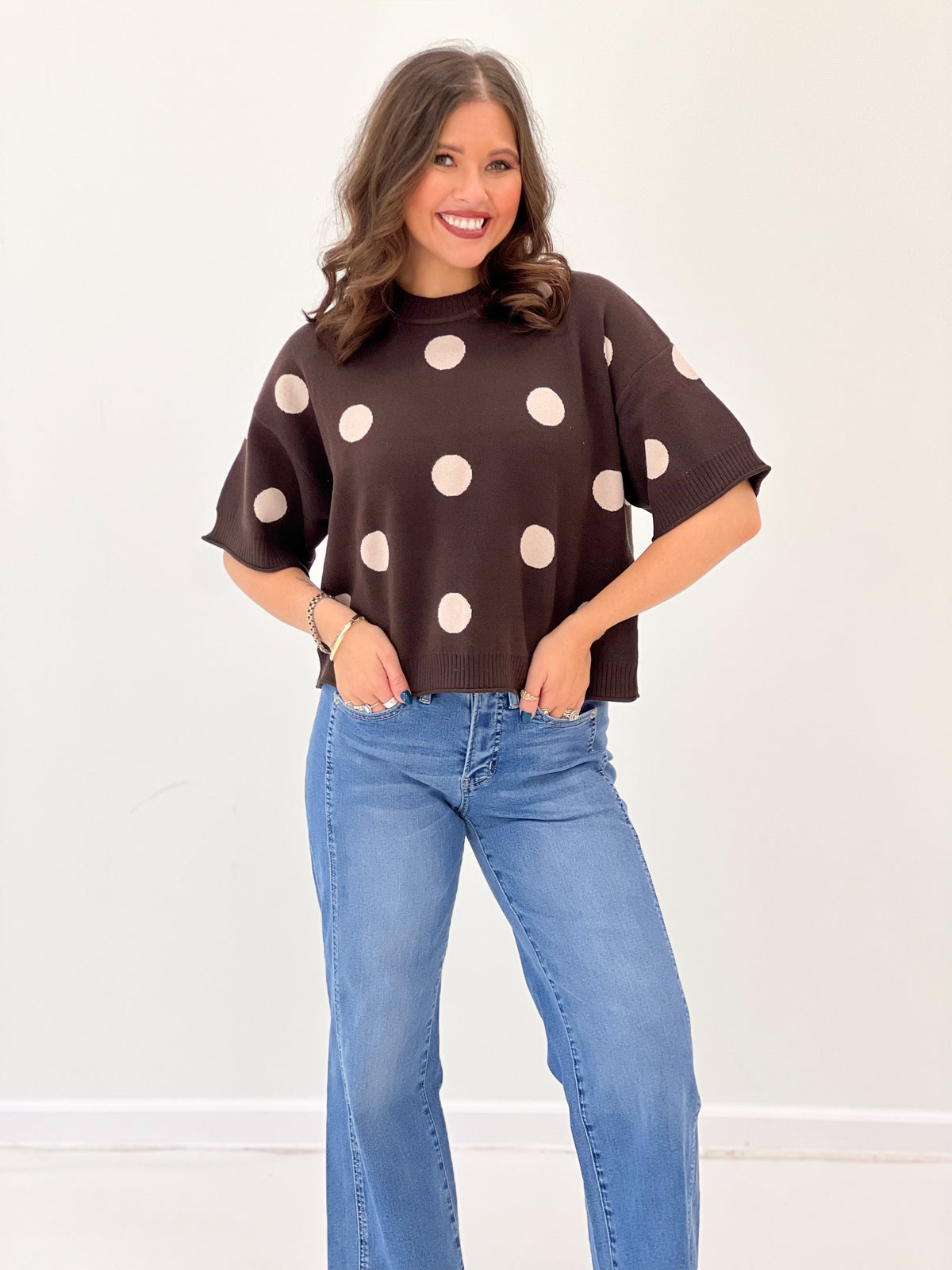 Brown polka dot sweater top with round neck and short cuffed sleeves