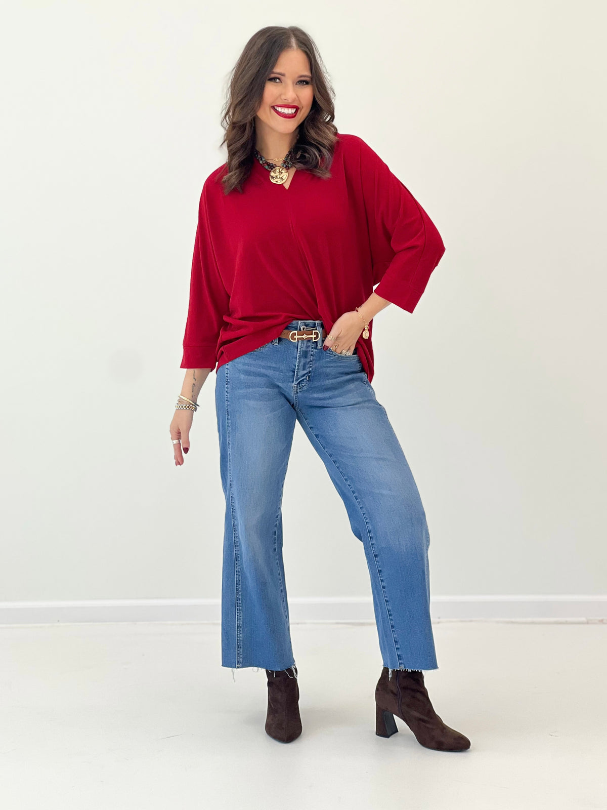 Red V-neck quarter-sleeve top with relaxed drape and slight batwing shoulders
