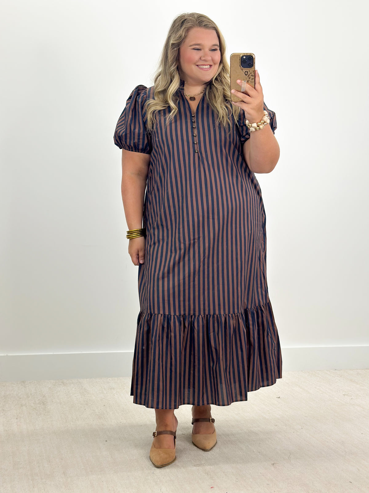 Navy and brown striped puff-sleeve midi dress with ruffled neckline and tiered hem