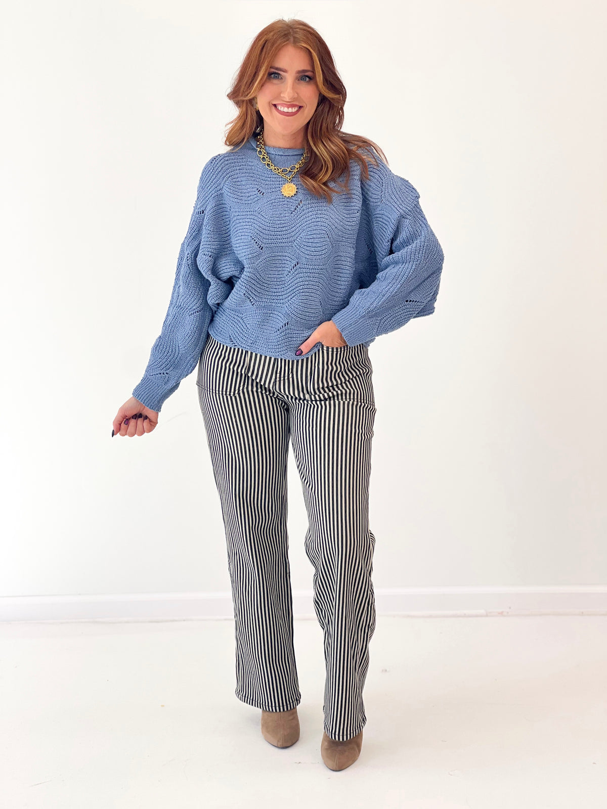 Dusty blue textured roll neck sweater with ribbed neckline and cuffs, relaxed fit
