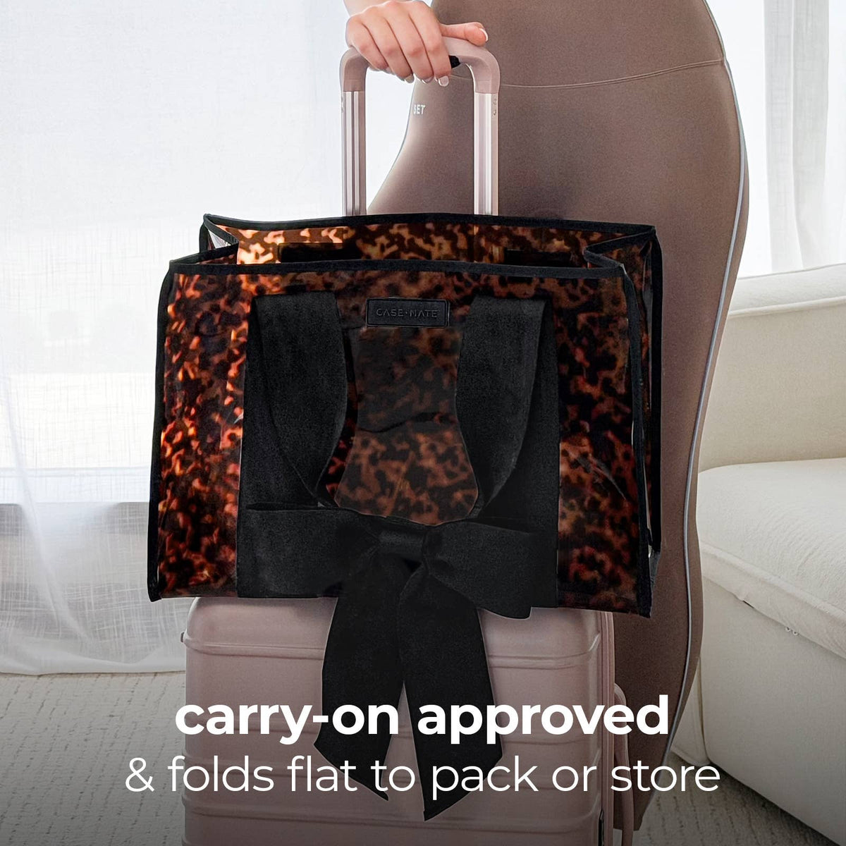 Carry-on tote bag with tortoiseshell interior print, black bow and structured handle