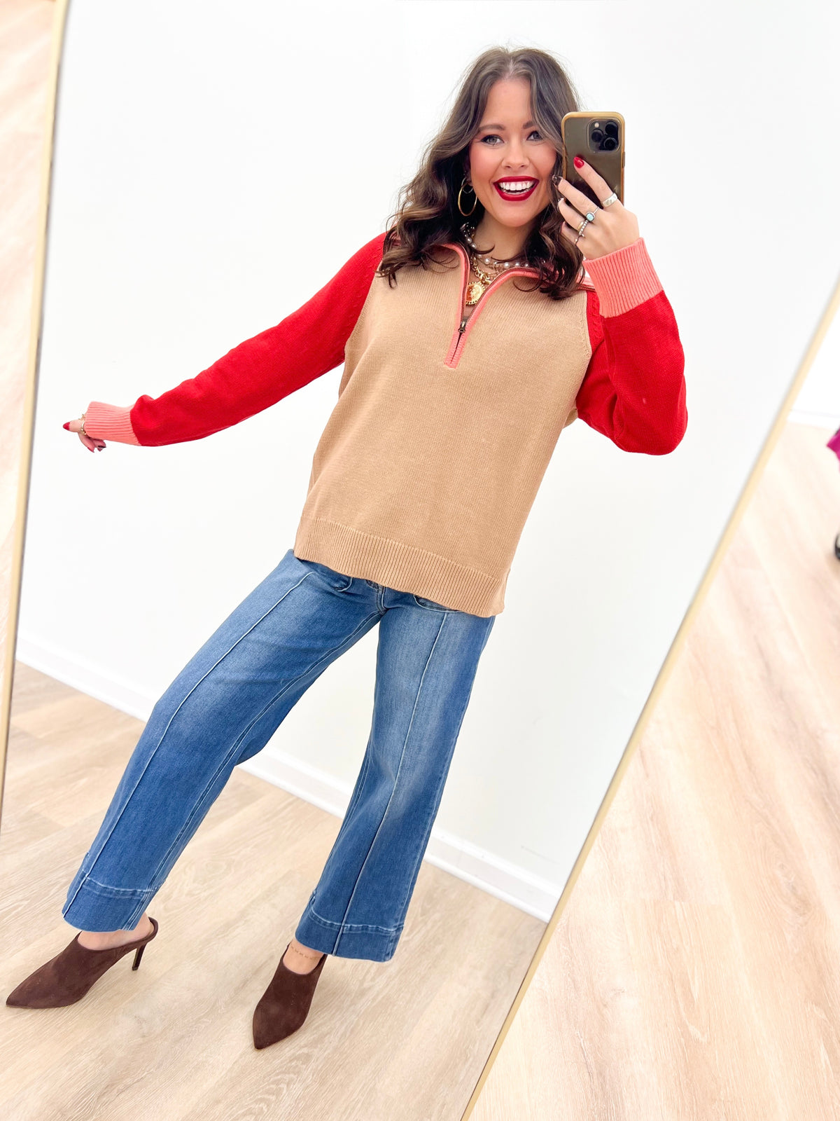 Taupe-and-red color-block sweater with half-zip neckline and long sleeves