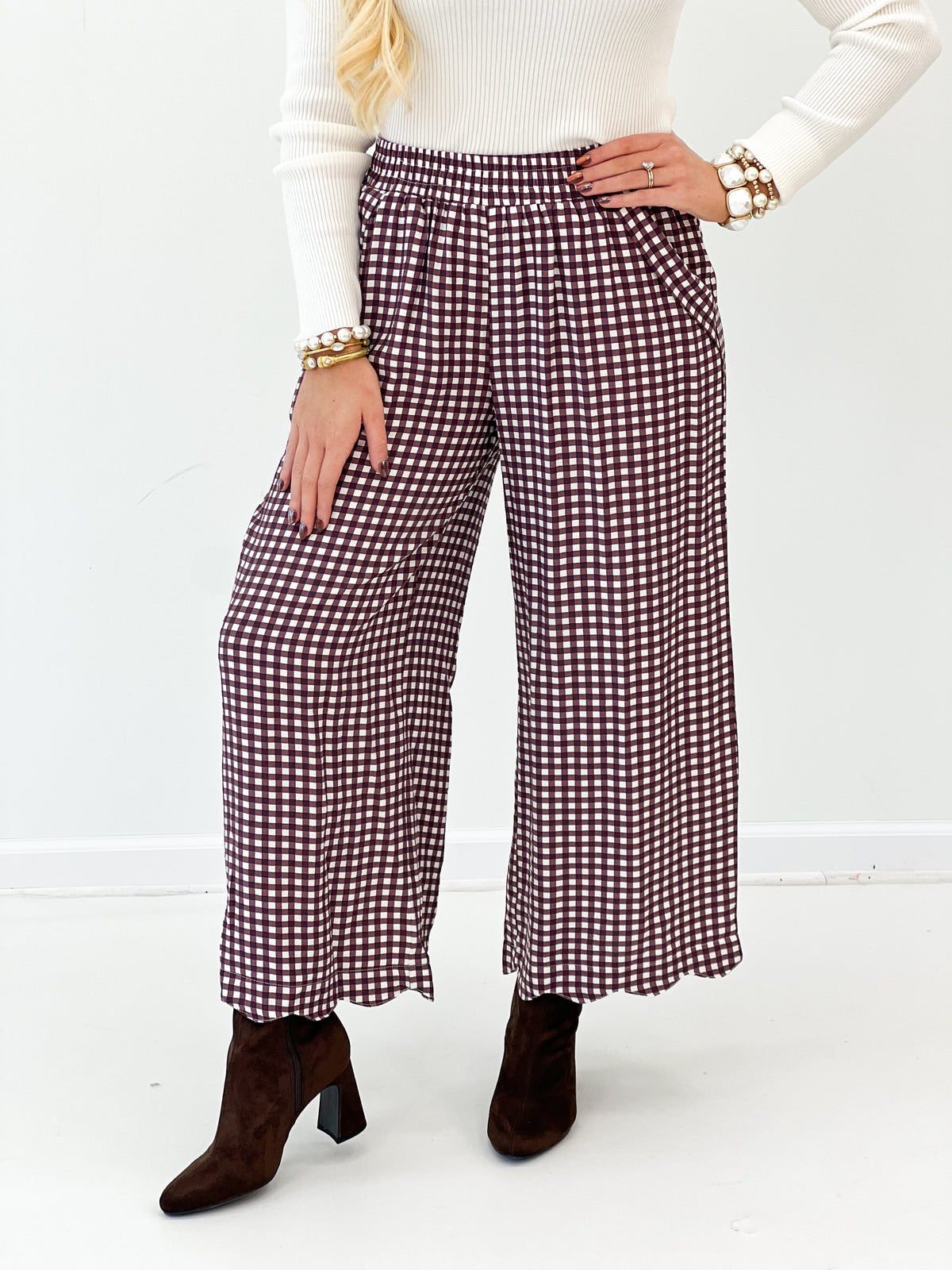 Red and white checkered wide-leg pants with smocked waistband and wide, straight legs