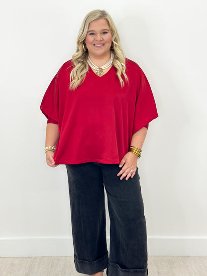 Ruby oversized v-neck top with cuffed batwing sleeves and relaxed fit
