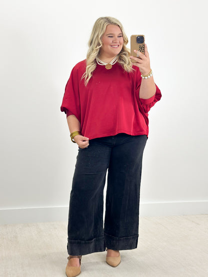 Ruby oversized v-neck top with cuffed batwing sleeves, elbow-length hem