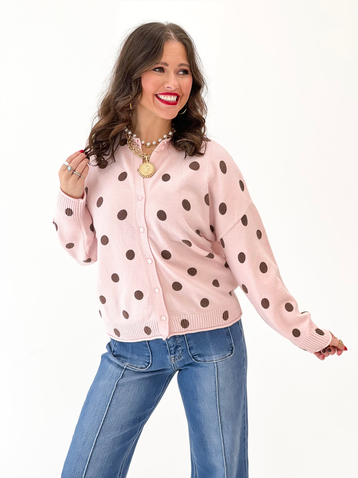 Polka dot knit cardigan, pink button-front top with long sleeves