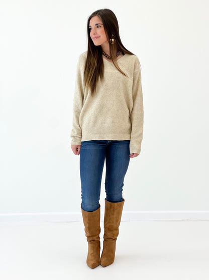 Oatmeal v-neck long-sleeve knit sweater, side profile with ribbed neckline