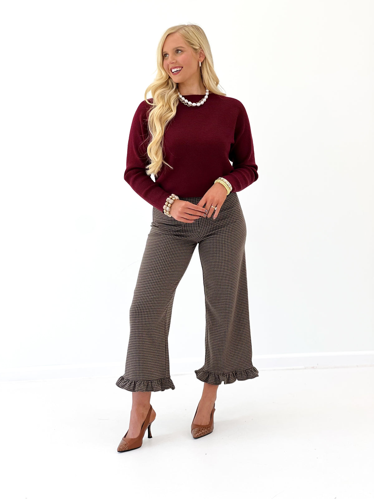 Mocha brown houndstooth pants with ruffle hem and flared leg