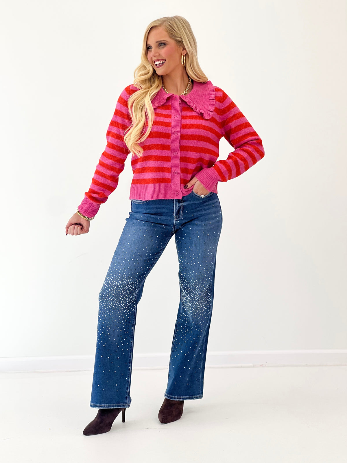 Hot pink striped sweater cardigan with ruffled collar and button-front, knit cuffs