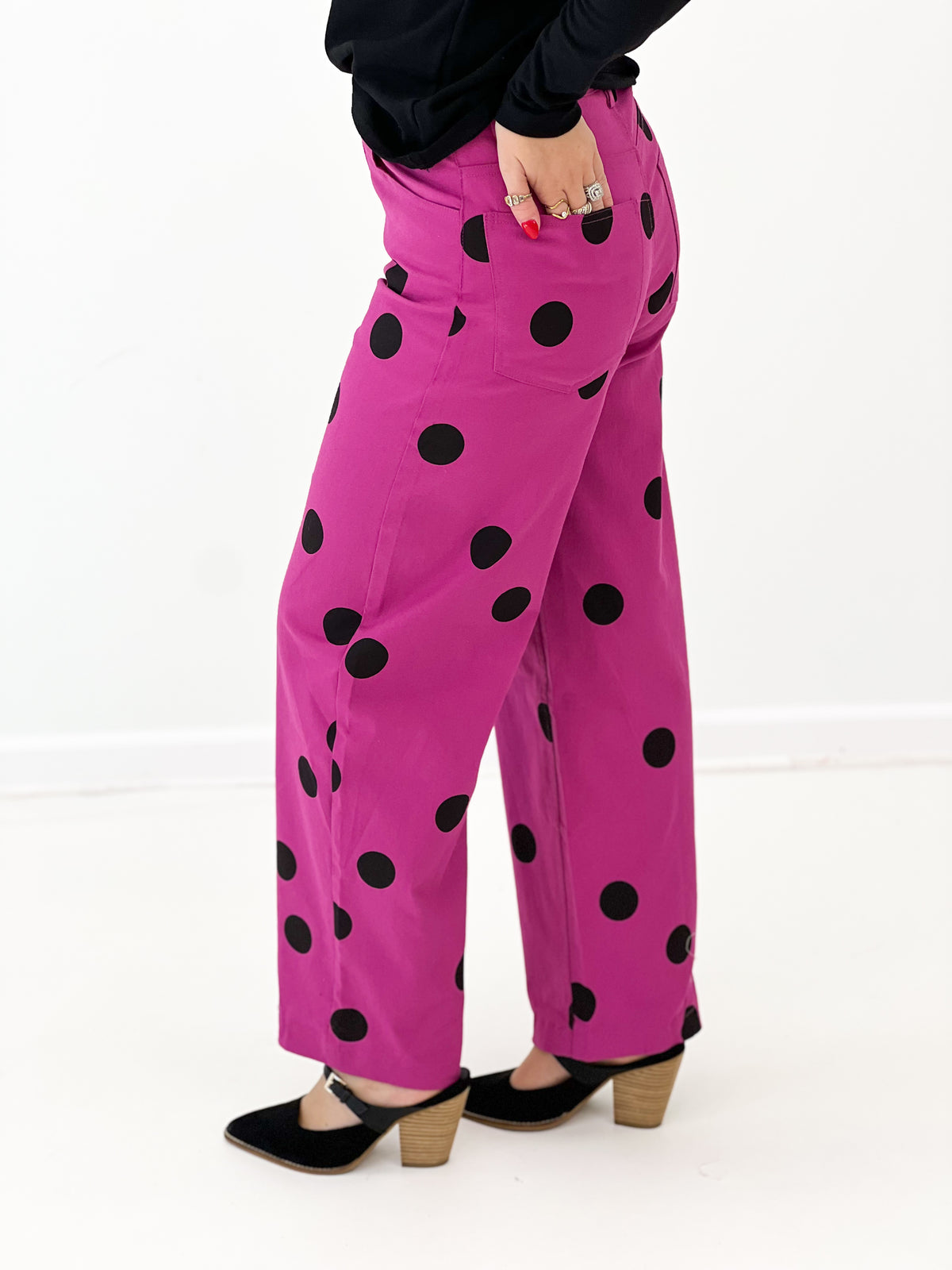 Magenta polka dot wide-leg stretch pants, black dots, front pockets, button front