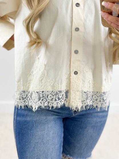 Ecru lace-trim puff sleeve button-down top with front buttons and scalloped hem