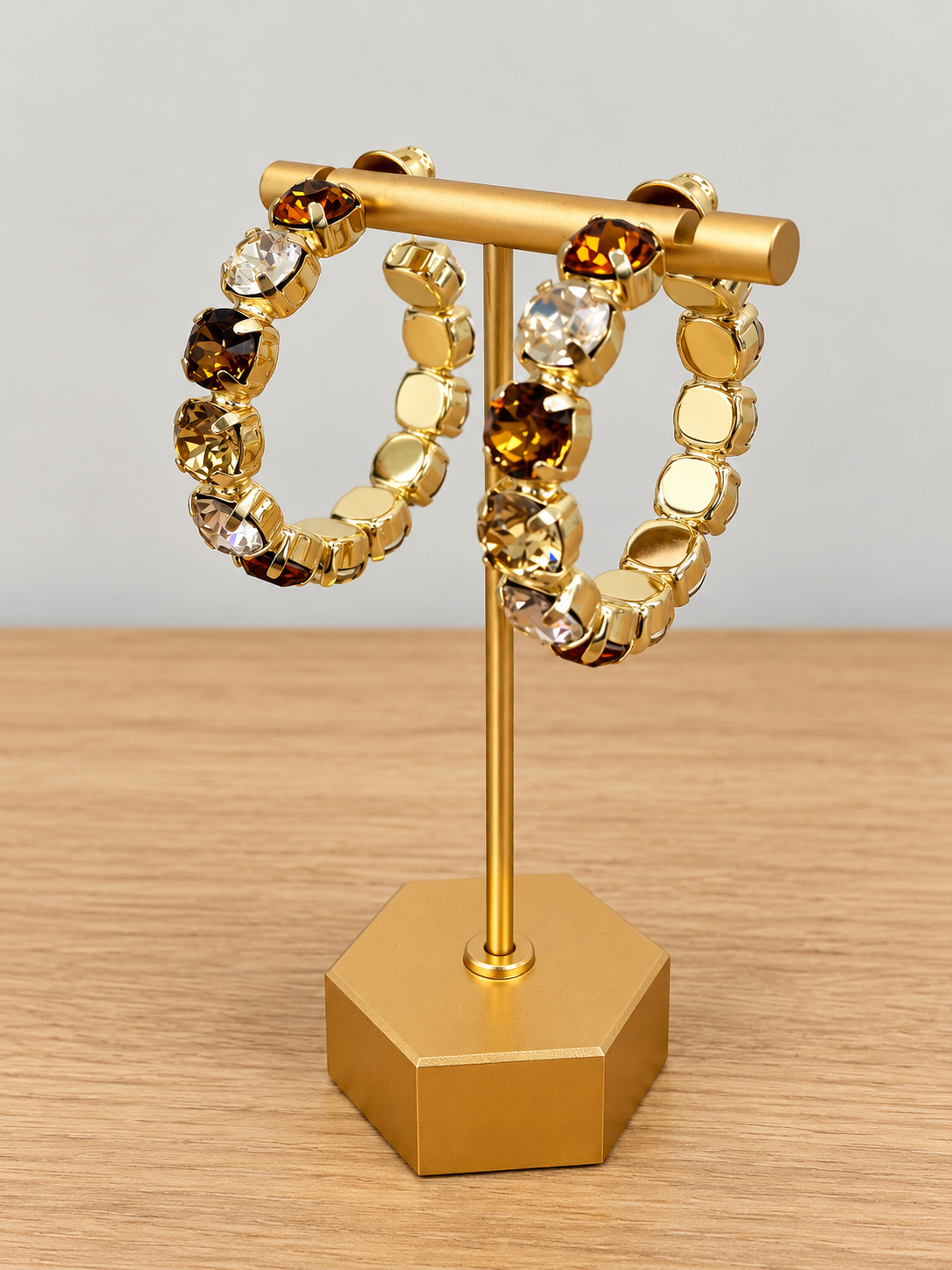 Pair of gold-tone hoop earrings with amber and clear faceted gemstone beads