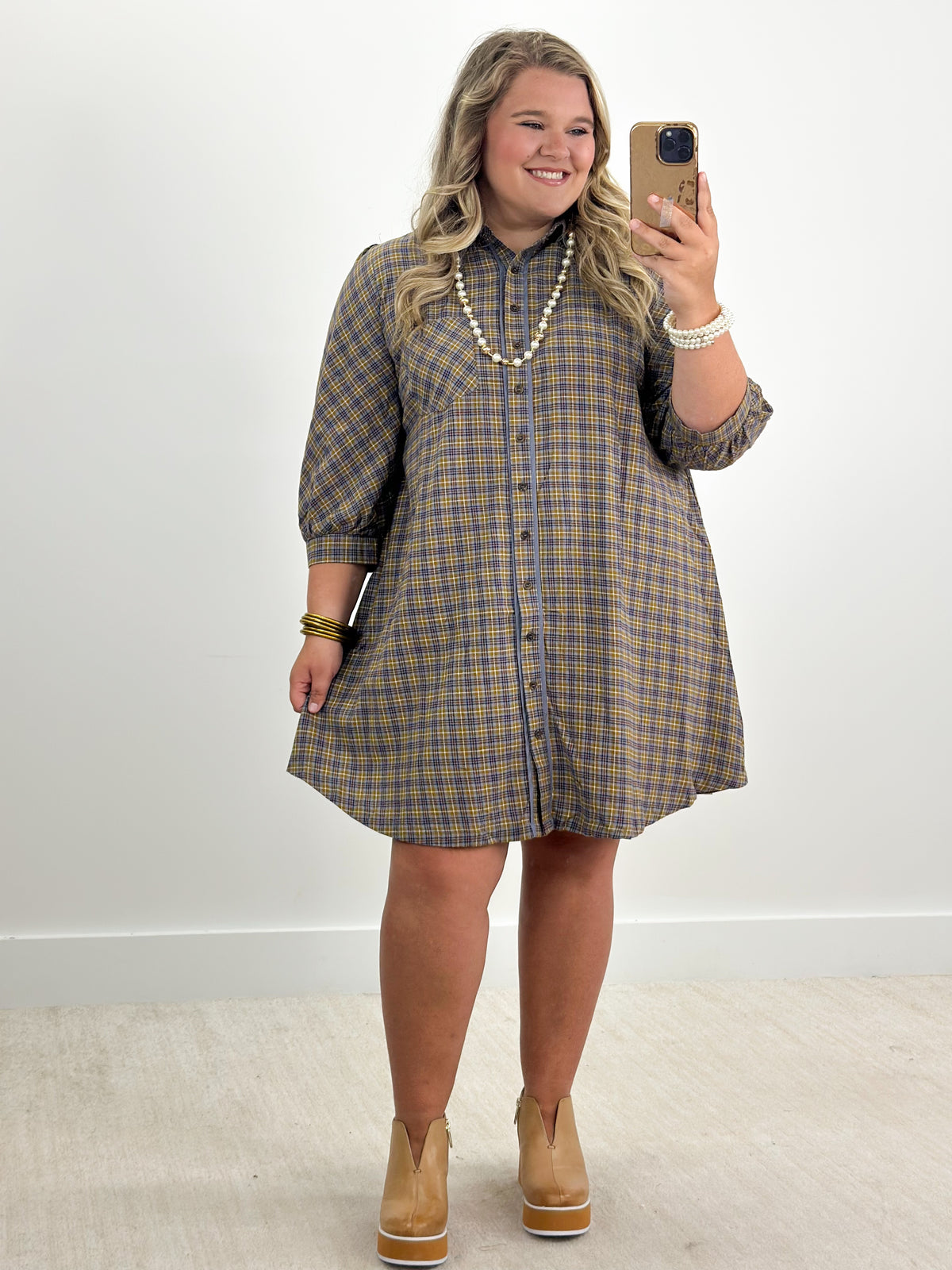 Blue plaid button-down long-sleeve dress with collar and front buttons, above-knee length
