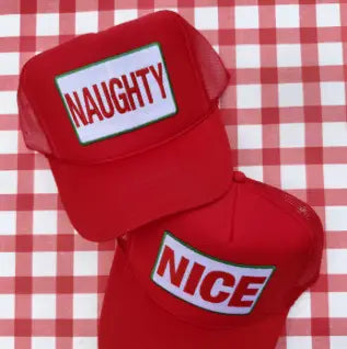 Red Christmas trucker hat with 'NAUGHTY' and 'NICE' front patches