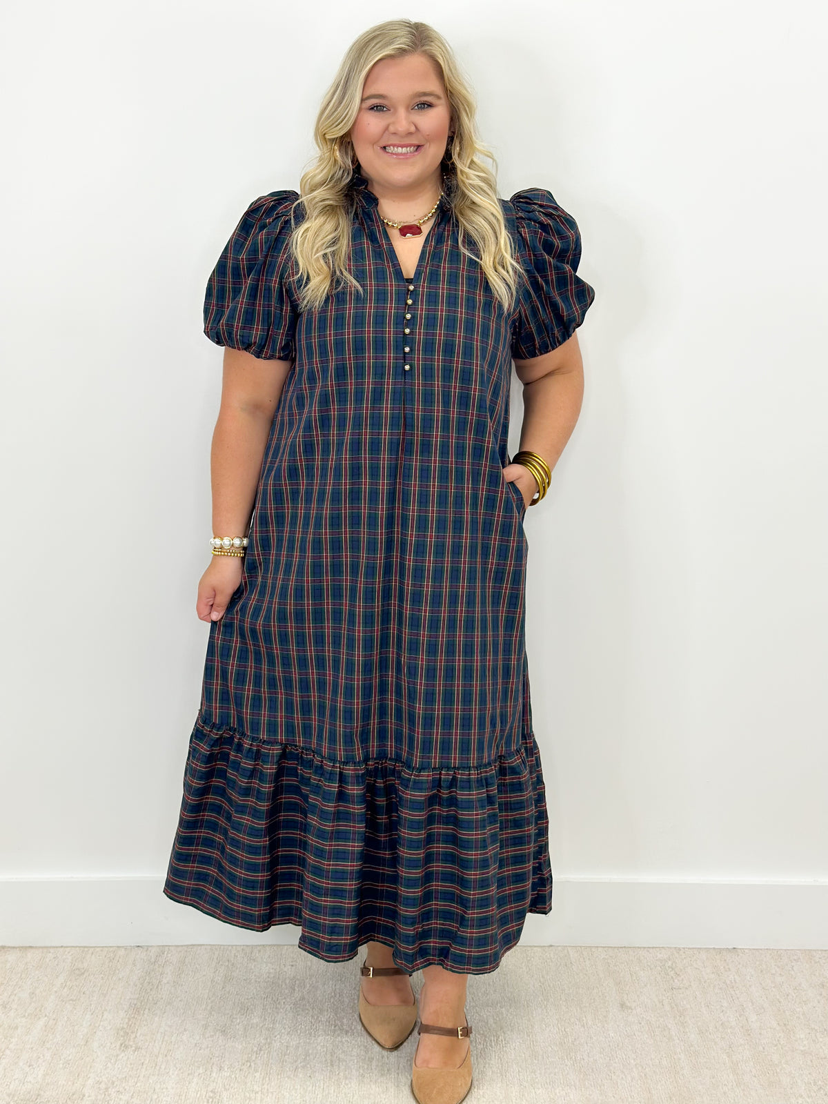 Blue plaid midi dress with puff sleeves and tiered ruffle hem at mid-calf