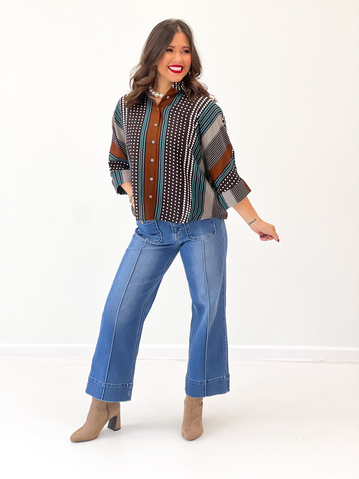 Brown mixed-print stripe shirt with button front and short sleeves, teal stripe accents
