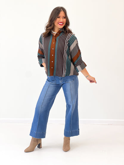 Brown mixed-print stripe shirt with button front and short sleeves, teal stripe accents