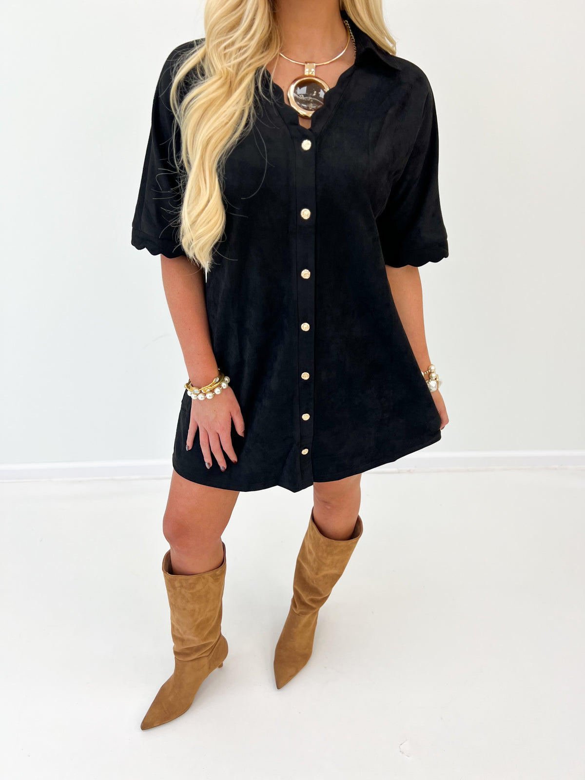 Black suede button-down scallop dress close view with short puff sleeves and light buttons