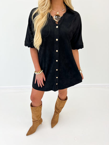 Black suede button-down scallop dress close view with short puff sleeves and light buttons