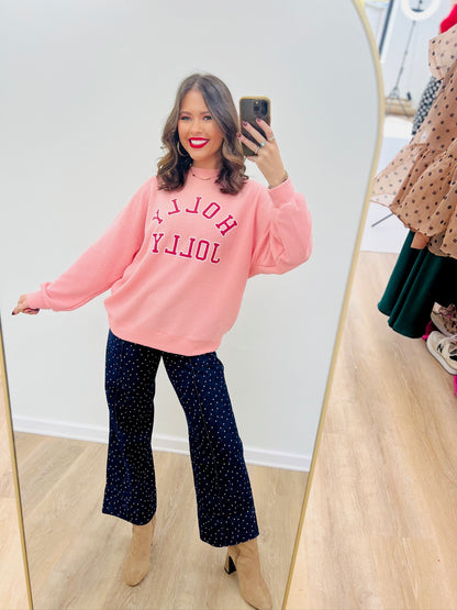 Pink knit Christmas sweatshirt with 'Holly Jolly' graphic, long sleeves