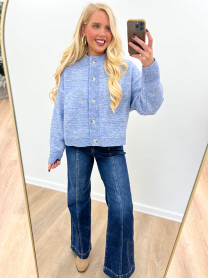 Denim blue marled knit cardigan, button-front with ribbed collar, cuffs, and hem.