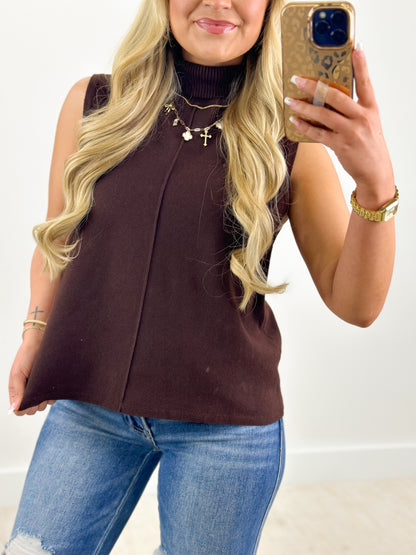 Dark brown sleeveless turtleneck knit top with high neckline and sleeveless cut