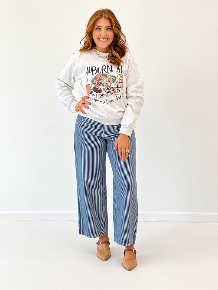 Light blue striped wide-leg pants with front pockets and belt loops