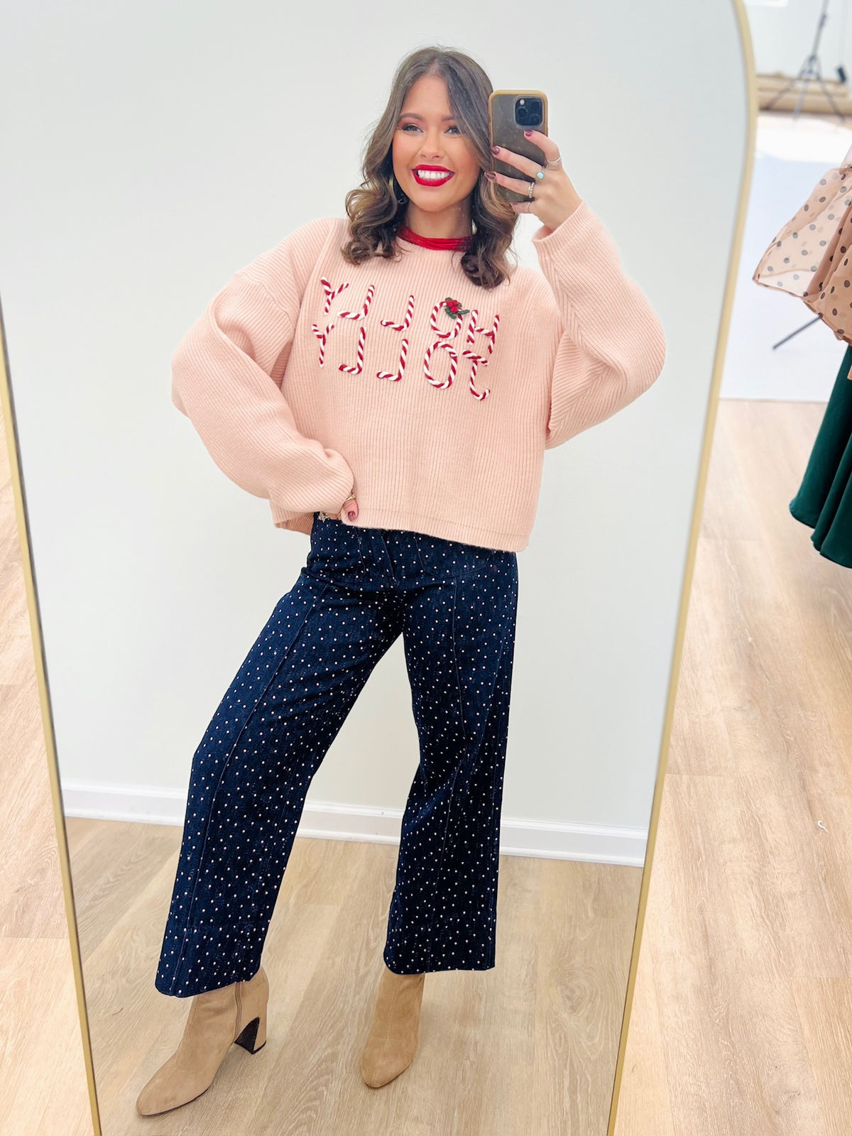 Light pink cropped knit sweater, red embroidered lettering, contrast red neckline