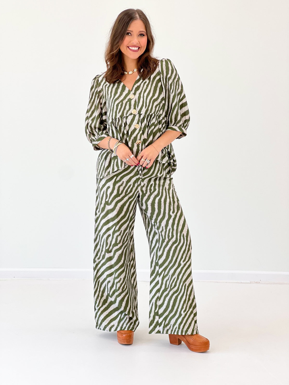 Olive zebra-print button-front puff sleeve top with V neckline, front view