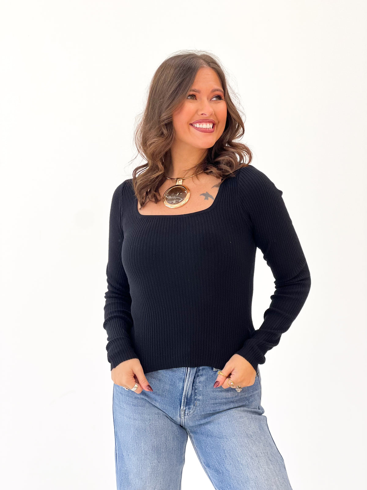 Black ribbed long-sleeve square-neck top with fitted knit cuffs