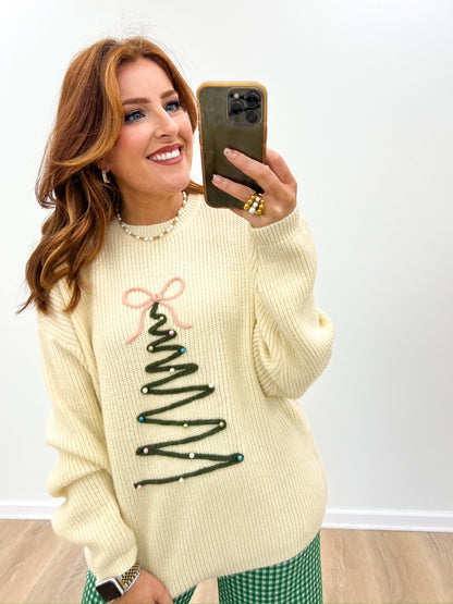 Cream oversized knit sweater with long sleeves and embroidered Christmas tree design