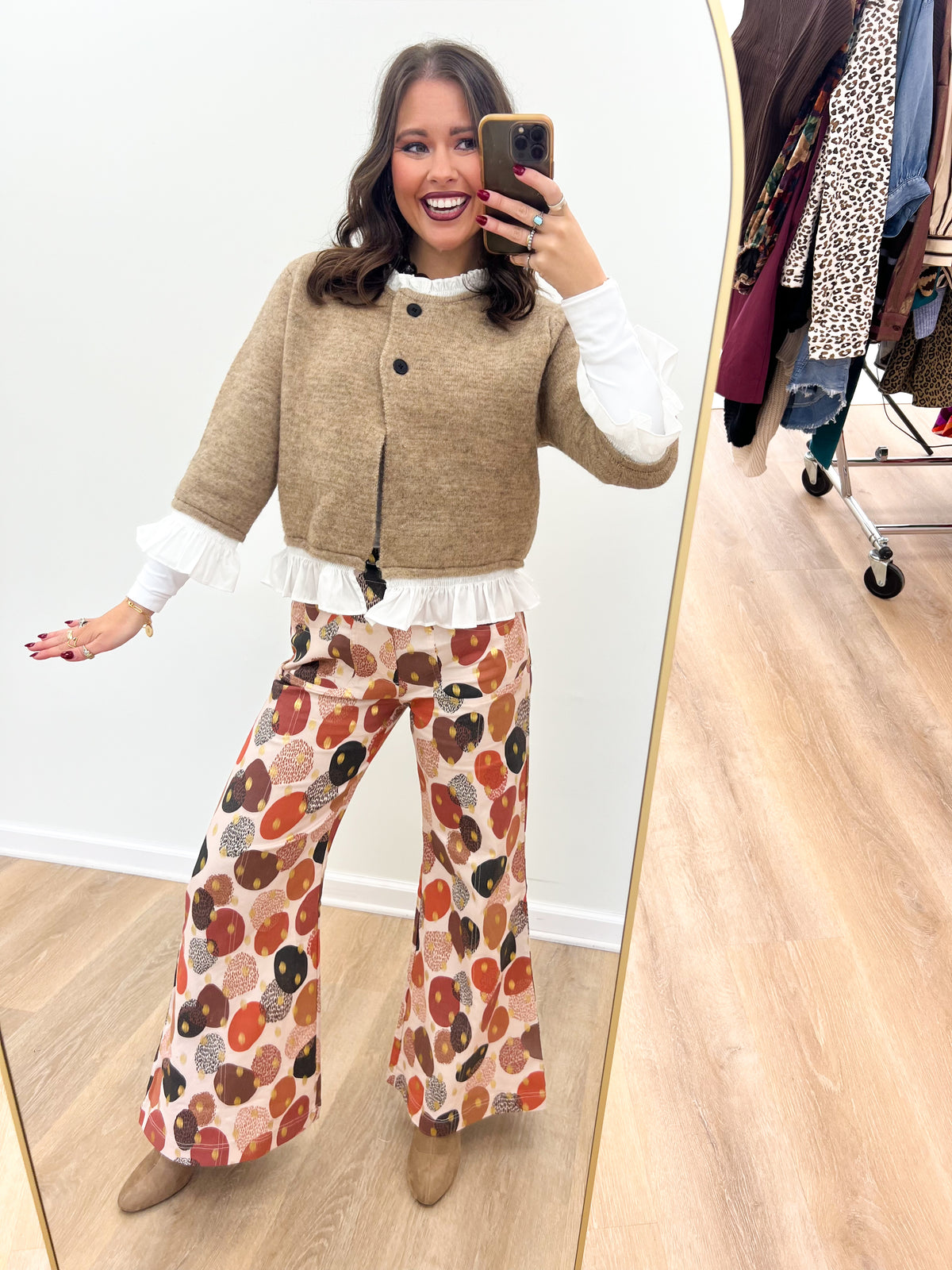 Mocha knitted cardigan top with button front and white ruffle hem, long sleeves