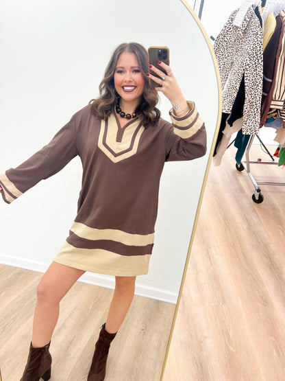 Brown V-neck color-block sweatshirt dress with cream stripe at hem and striped cuffs