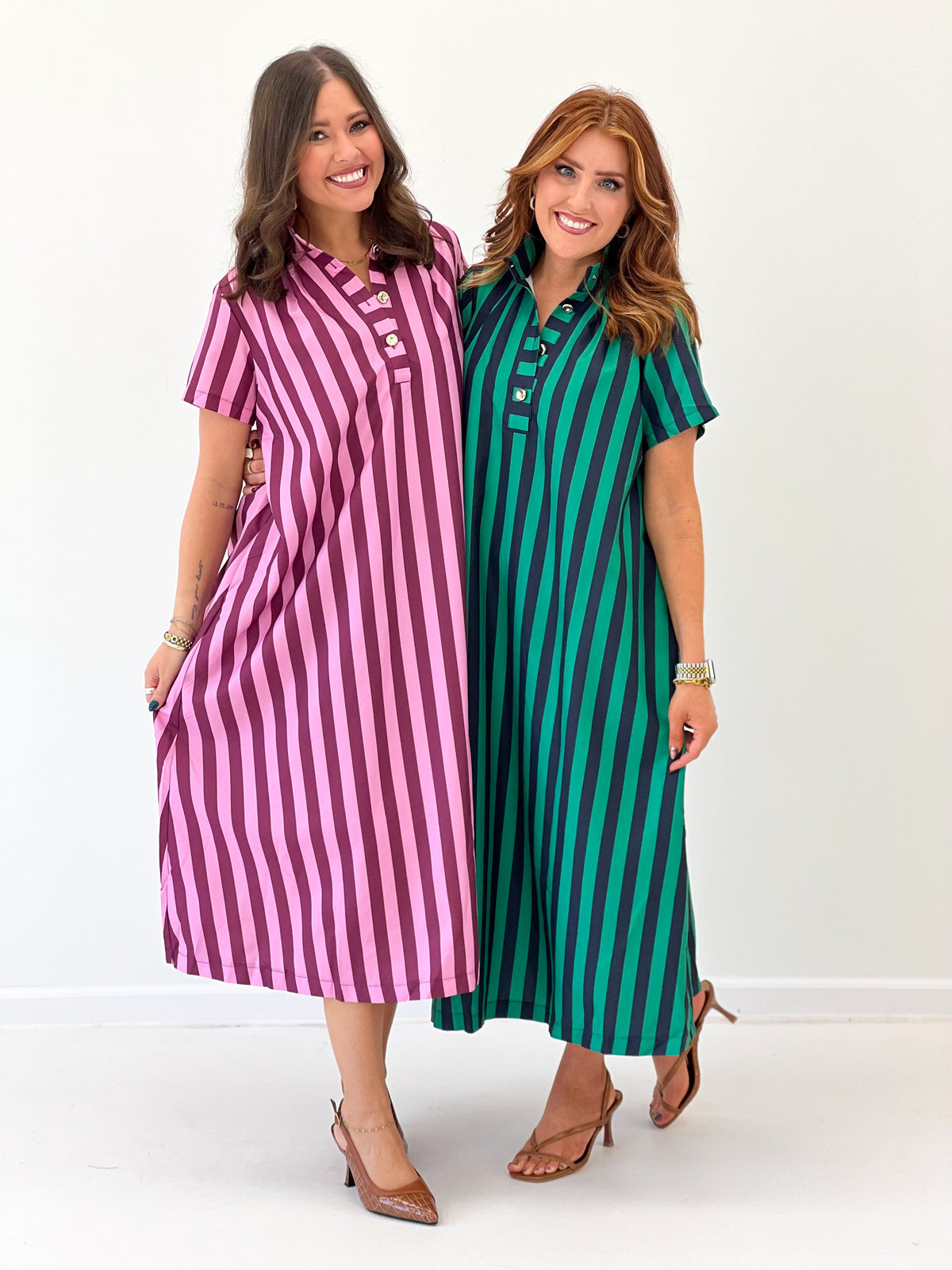 Two striped midi dresses: pink and teal, each with high neck, button placket, short sleeves