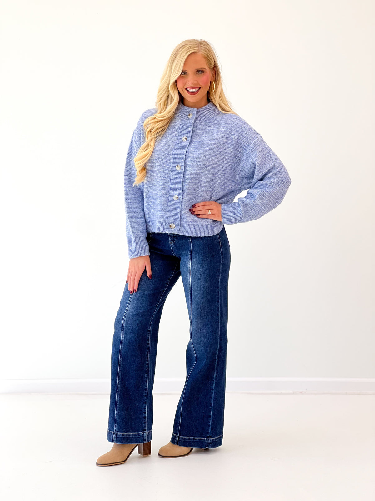Denim blue marled knit cardigan, button-front with ribbed collar and long sleeves.