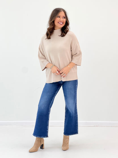 Oatmeal mock neck short-sleeve sweater with drapey fit and ribbed cuffs