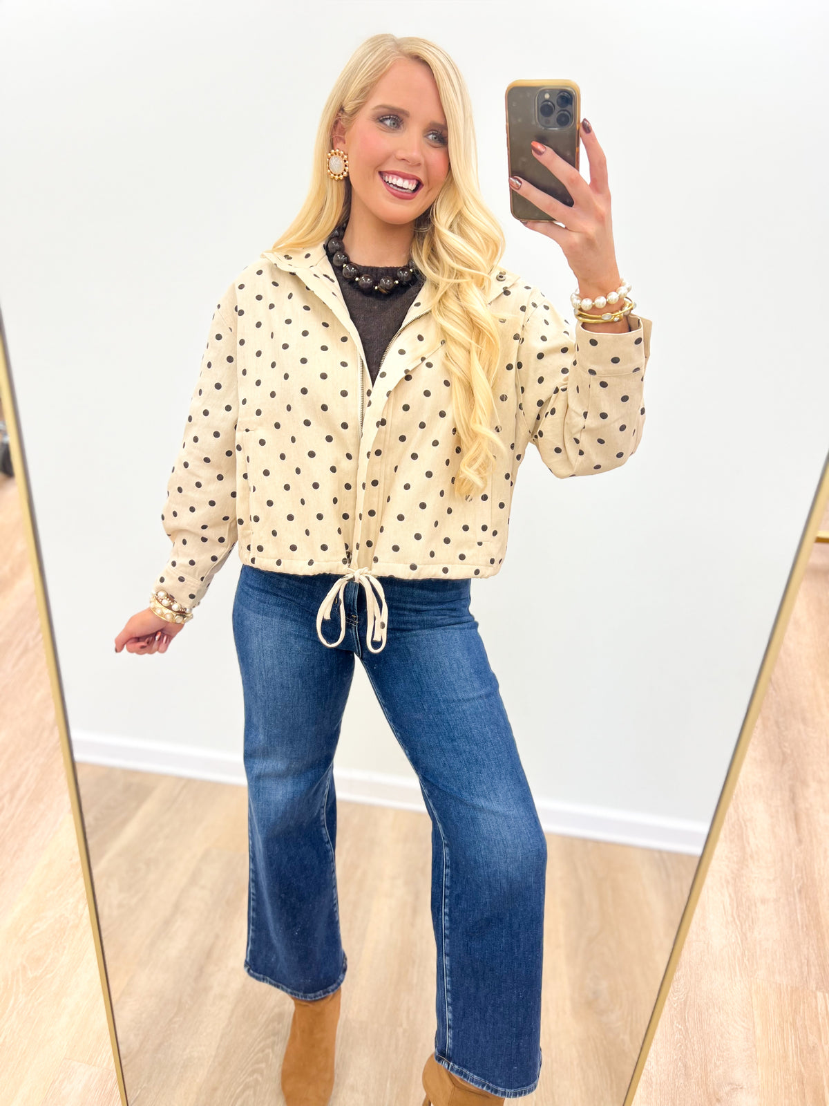 Ecru polka dot tie-front jacket with hooded collar, button front, drawstring waist