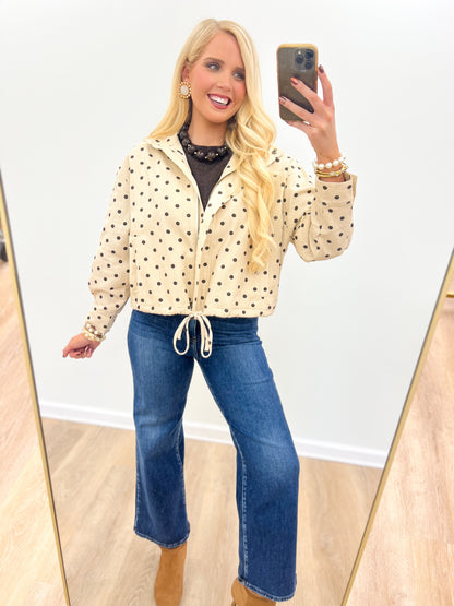 Ecru polka dot tie-front jacket with hooded collar, button front, drawstring waist
