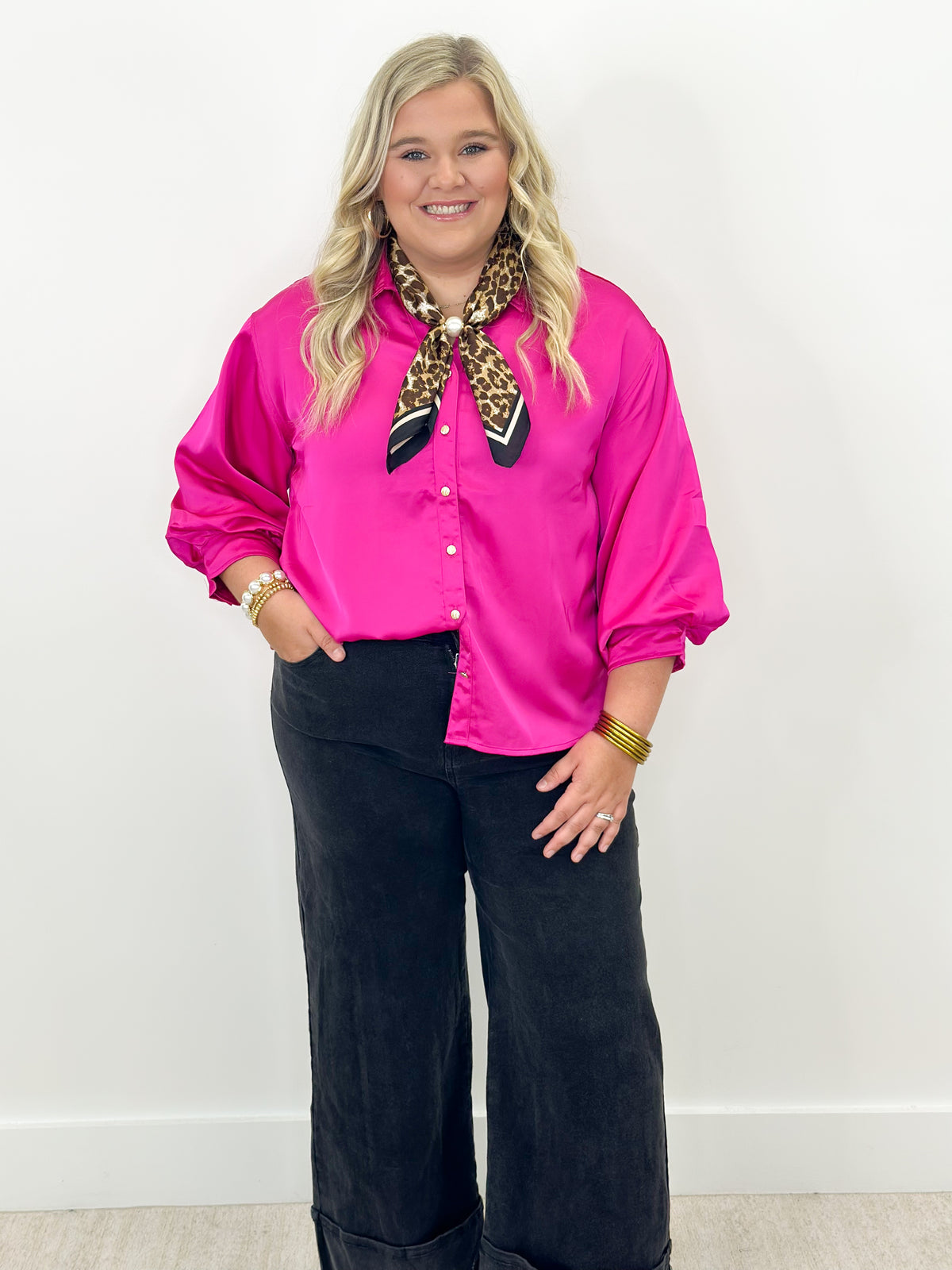 Fuchsia button-front shirt with puff sleeves and leopard neck scarf accessory