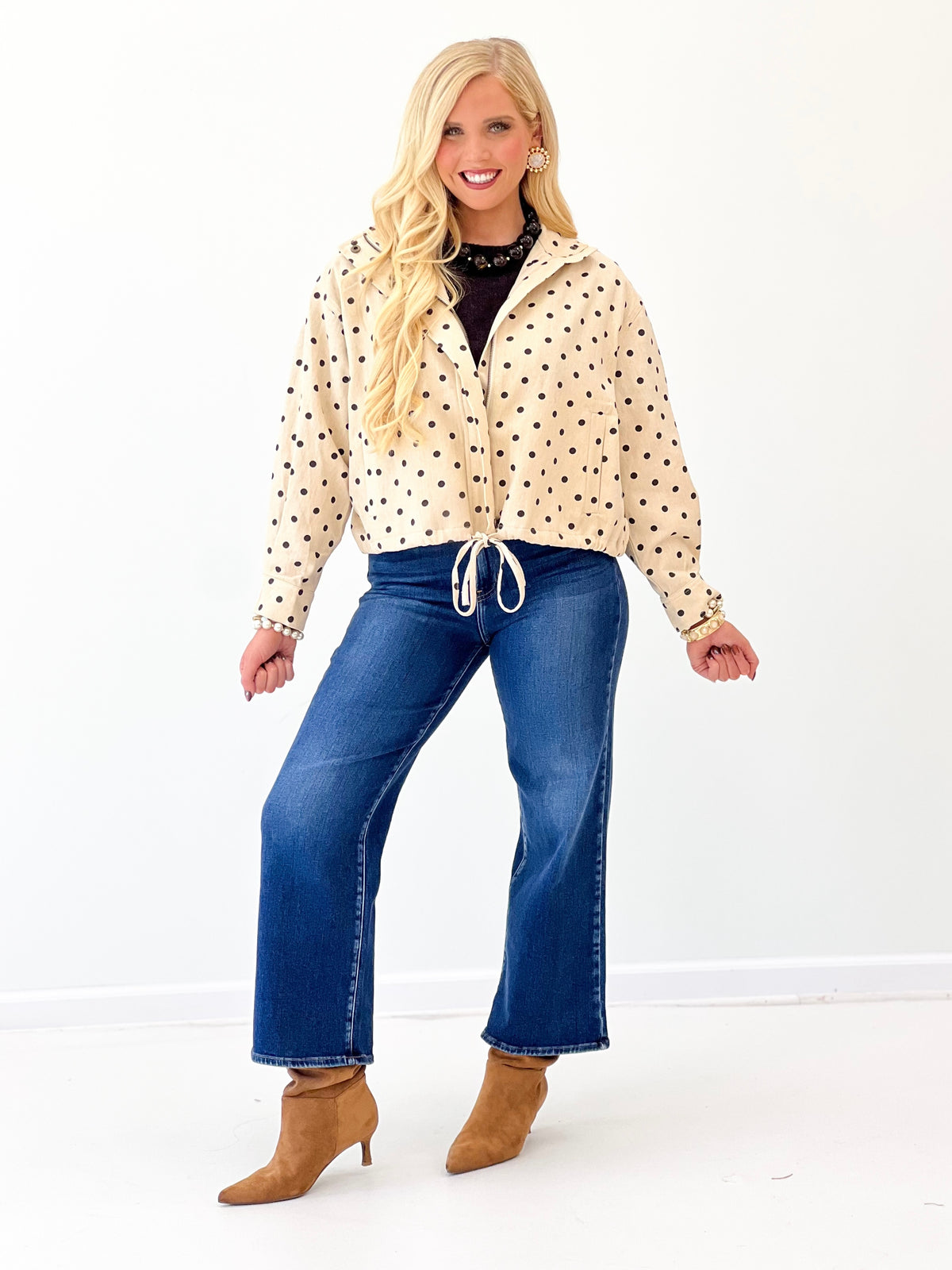 Ecru polka dot tie-front jacket with full button front and drawstring waist detail