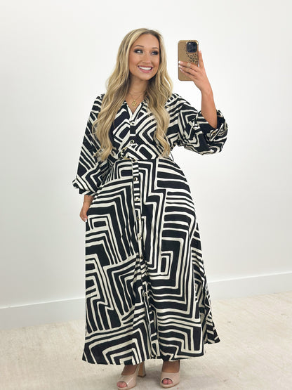 Collared button-down tie dress, black and white geometric pattern, midi length, belt tie