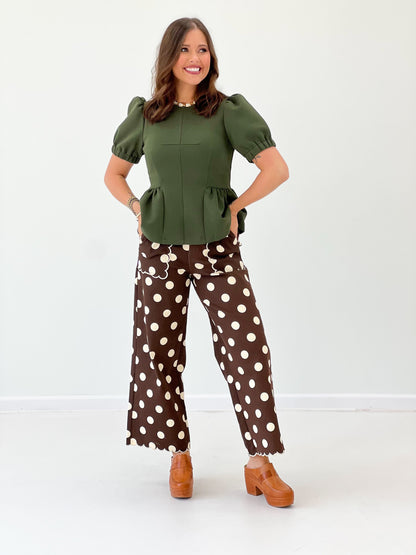 Olive green peplum hem knit top with short puff sleeves and gathered waist