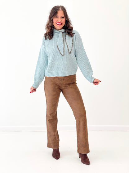 Dusty mint knit sweater with high neck scarf-stitch detail and cord ties